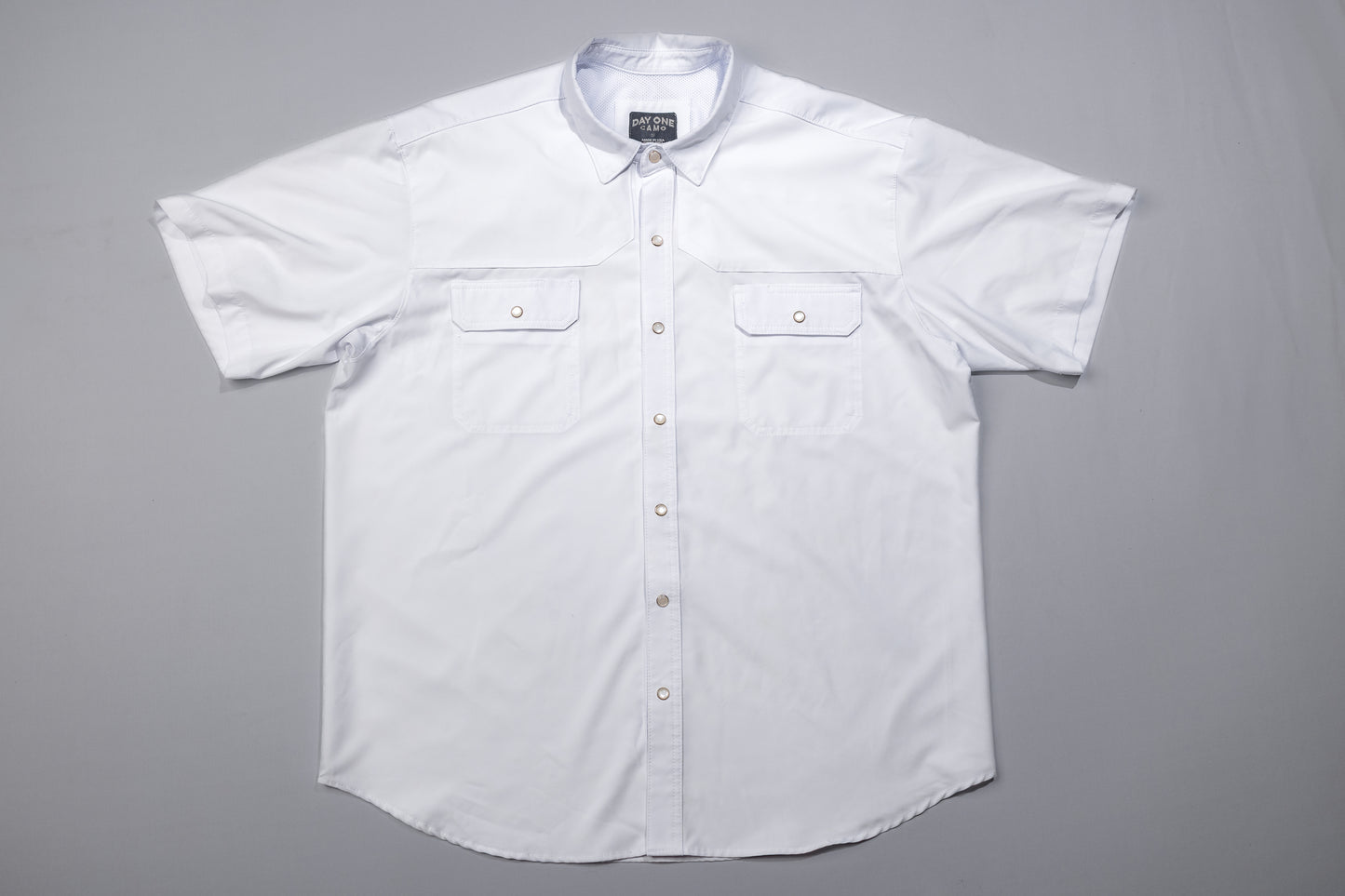 White short-sleeve shirt on a gray background