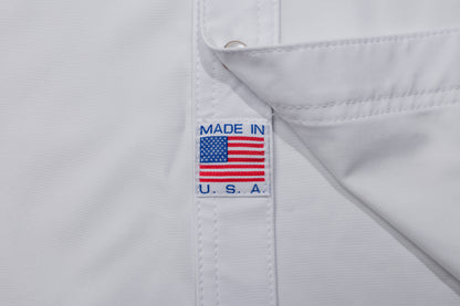 White shirt with 'Made in U.S.A.' label featuring an American flag on a white background